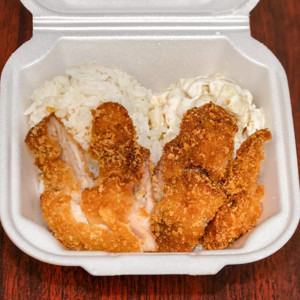 F's Hawaiian Food's crispy chicken katsu, white rice, and macaroni salad in a takeout container.